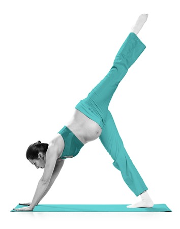 Pregnant woman making exercise, isolated on whiteの写真素材