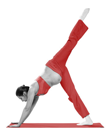 Pregnant woman making exercise, isolated on whiteの写真素材