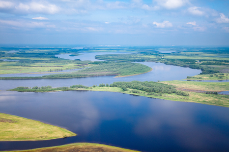 Big river in flooding period, top viewの写真素材