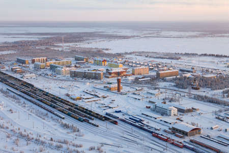 Trains with oil tanks at the railway station in the village of Purpe in the Yamalo-Nenets Autonomous Okrug in winterの写真素材