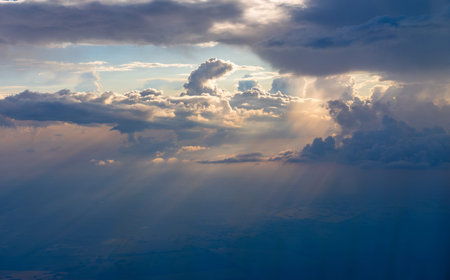 Stunning aerial view of cumulus clouds on sunset background. The last sliding rays of the leaving...