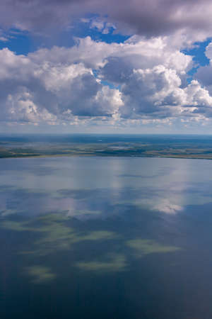 Air photo of lake during cloudy summer dayの写真素材