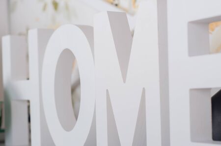 Big white letters. Lettering Home. Close upの写真素材