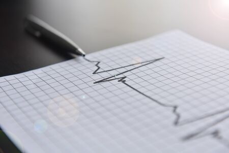 Pulse and business. Business chart and pen. Business concept pen and chart.の写真素材