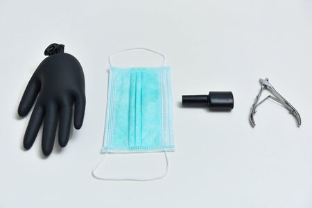 Gel polish, medical mask, manicure scissors, nail file, coronavirus equipment concept. Collage manicure set with coronavirus, 2019-nCoV. Gel polish equipments and coronavirus, COVID-19, 2019-nCoV.の写真素材