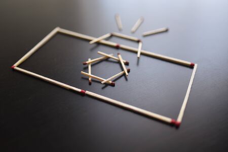 Camera from matches on a black wood. Concepts of matches, picture camera.の写真素材