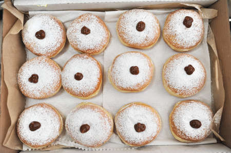 Hanukkah symbol jewish food holiday image of donut with caramel, sugar powders.の写真素材