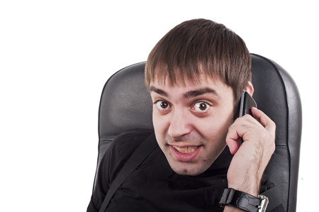 buisiness man in chair with phone の写真素材