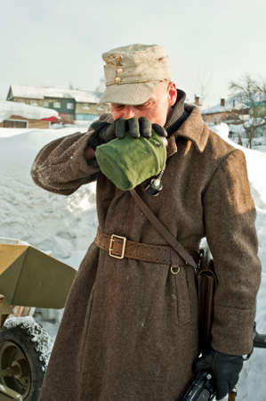 soldier drinks from a flaskの写真素材