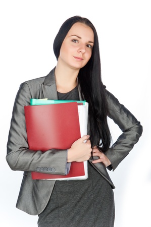 young beautiful businesswoman holding folders,isolated on whiteの写真素材