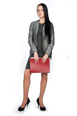 young beautiful businesswoman holding folders,isolated on whiteの写真素材