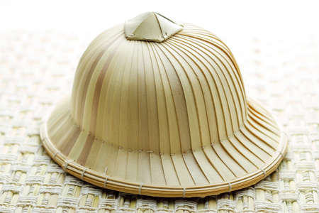 Hat made of palm leaves shaped の写真素材