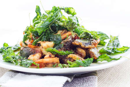 Fried century egg with shrimp and crispy basil leafの写真素材