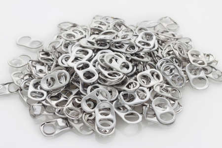 The Pulled open aluminum cans and Soda bottle cap