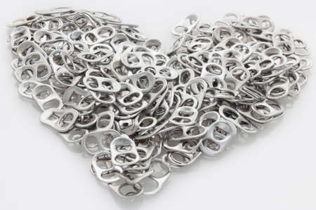 The Pulled open aluminum cans and Soda bottle capの写真素材
