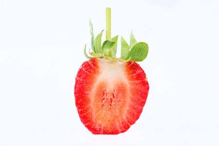 Fresh strawberry slice on a white の写真素材
