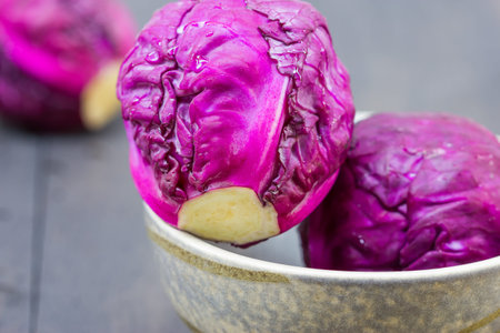 Red cabbage on wooden background close up shoot