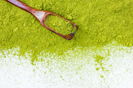 border of powdered green tea top view close up isolated on white の写真素材
