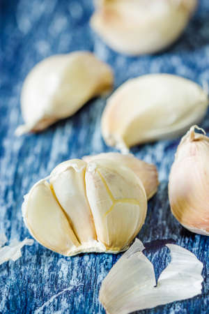 Organic garlic cloves on the wooden backgroundの写真素材