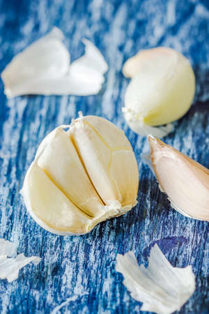 Organic garlic cloves on the wooden backgroundの写真素材