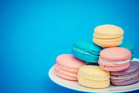 Sweet and colourful french macaroons on retro-vintage backgroundの写真素材