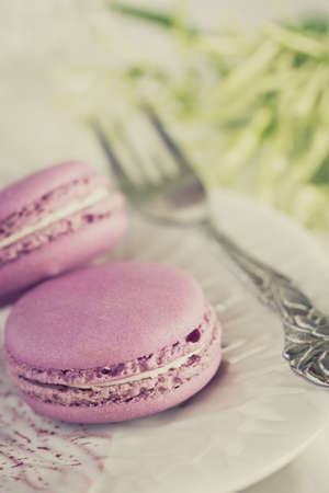 French macaron in plate on tableの写真素材