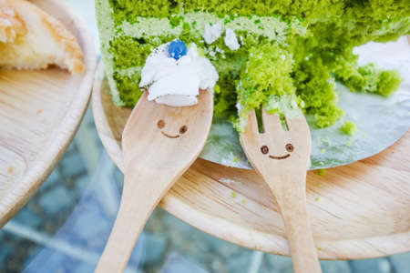 Japanese Matcha Green tea cake on wooden plateの写真素材