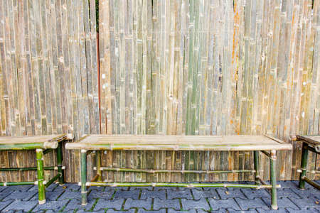 bamboo bench with sitting in ornamental gardenの写真素材
