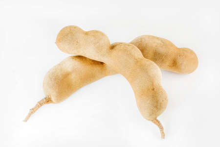 Sweet tamarind fruits isolated on white backgroundの写真素材