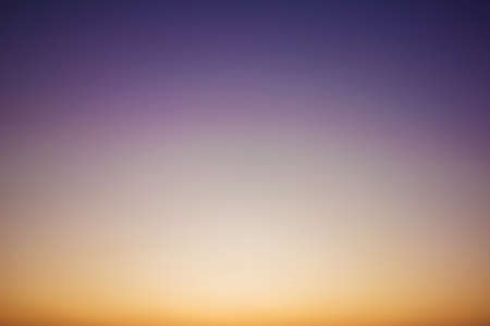 Sky gradient from blue to orange sunsetの写真素材