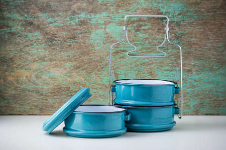 Metal tiffin, Thai food carrier on wooden background.の写真素材