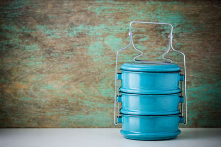 Metal tiffin, Thai food carrier on wooden background.の写真素材