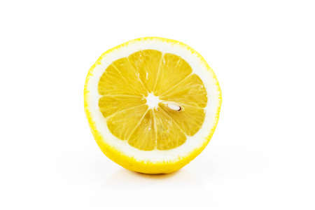 Juicy half of a lemon on a white backgroundの写真素材