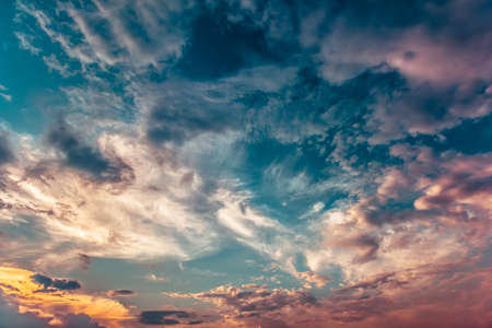 Beautiful yellow blue sunset sky with sunlightの写真素材