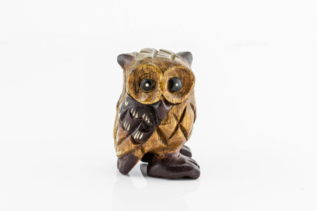 Wooden carved Owl on white backgroundの写真素材