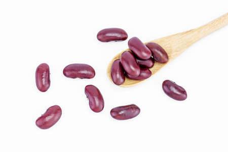 Red kidney beans on a wooden spoon isolate on white backgroundの写真素材
