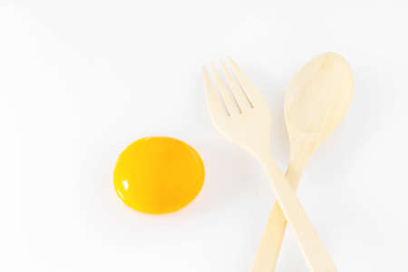 Egg spoon and fork on white backgroundの写真素材