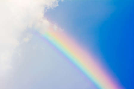 rainbow in the blue sky after the rainの写真素材