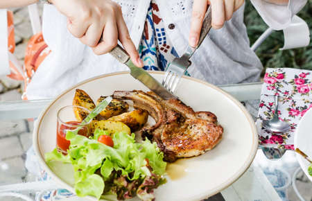 Pork chop with fried potatoes cream sauceの写真素材