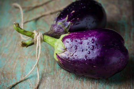 still life with Eggplant (aubergine) on wooden backgroundの写真素材