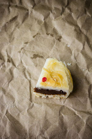 Asian Traditional Dessert, Homemade moon cake on brown paper backgroundの写真素材