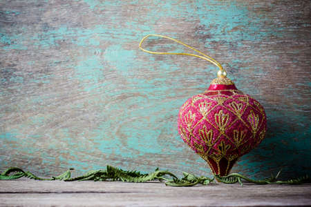 christmas decoration red ball over wooden backgroundの写真素材
