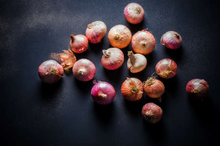 Organic Red Pearl Onions on wooden backgroundの写真素材