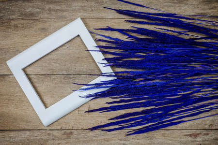 Closeup blue grass flowers on wooden backgroundの写真素材