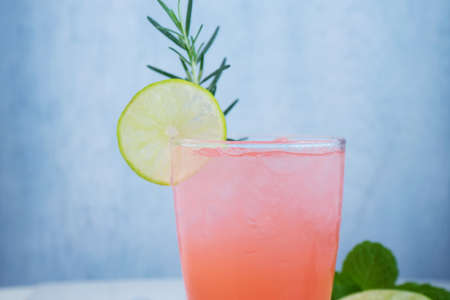 Refreshing summer drink with fruit punch in glassesの写真素材