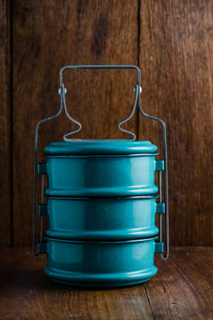 Metal tiffin, Thai food carrier on wooden background.の写真素材