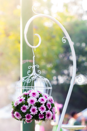 Bouquet made of  Chrysanthemum in white birdcage