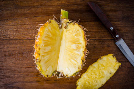 Sliced pineapple on a cutting board background.の写真素材