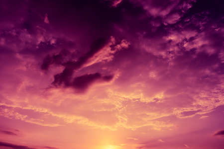 colorful dramatic sky with cloud at sunsetの写真素材