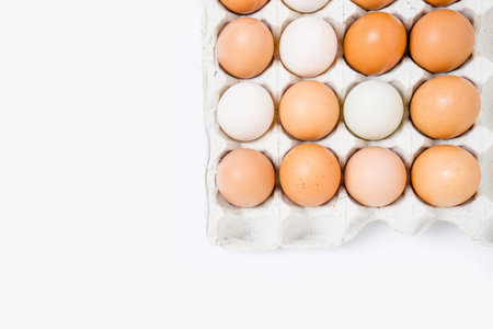 group of eggs in paper tray on white background.